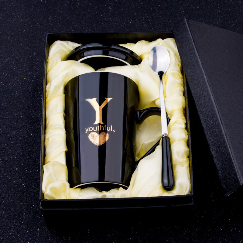 Elegant Black and Gold Ceramic Mug with Lid and Spoon