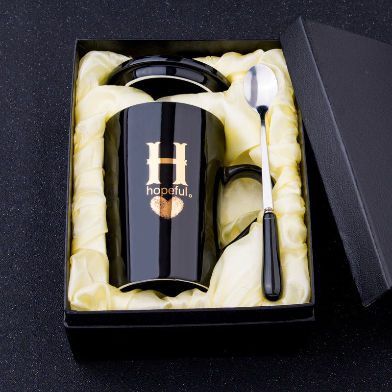 Elegant Black and Gold Ceramic Mug with Lid and Spoon