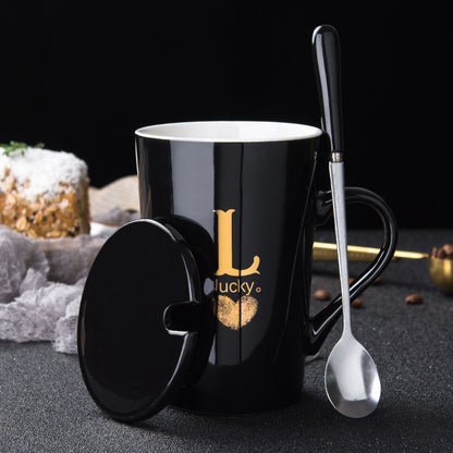 Elegant Black and Gold Ceramic Mug with Lid and Spoon