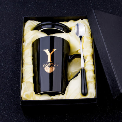 Elegant Black and Gold Ceramic Mug with Lid and Spoon