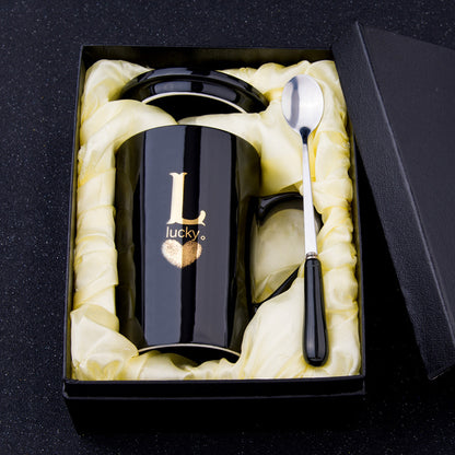 Elegant Black and Gold Ceramic Mug with Lid and Spoon